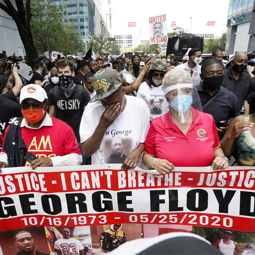 Demonstration with hundred of people asking for justice in the killing of George Floyd. Sign says: "Justice -- 'I Can't Breath' -- George Floyd."